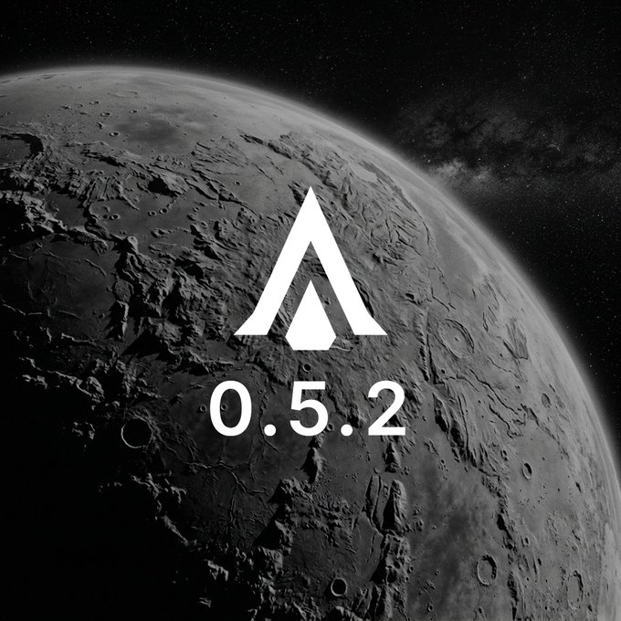 A grayscale image of a cratered moon against a starry sky features a white stylized arrow logo and the text '0.5.2' in the center.