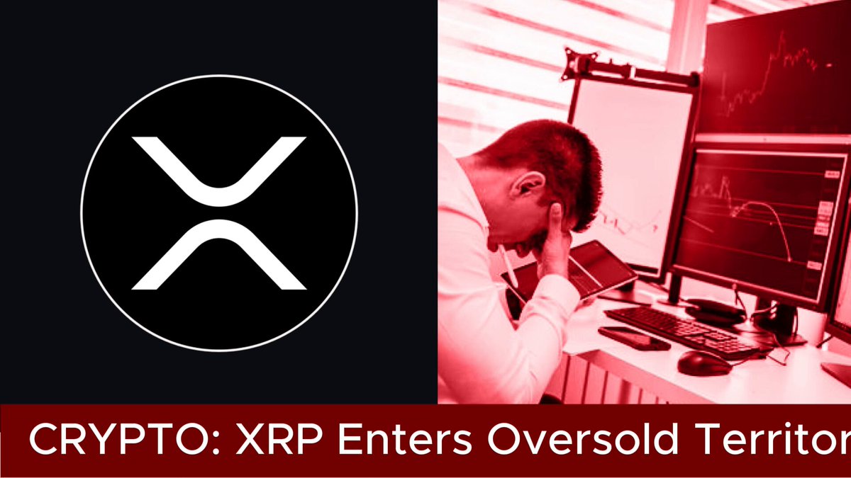 The image features a man sitting at a desk with a computer monitor, keyboard, and mouse. He appears to be working or studying, possibly using a laptop that is placed next to him. In front of the man, there are two monitors displaying market data related to cryptocurrency. The text "XRP Enters Oversold Territory" can be seen in the image, which suggests that XRP has entered the oversold territory following a sharp market correction. This information might be useful for those interested in understanding how different cryptocurrencies perform during market fluctuations.