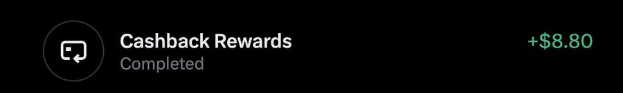 A dark-themed notification showing 'Cashback Rewards Completed' with a reward of +$8.80 displayed in green.