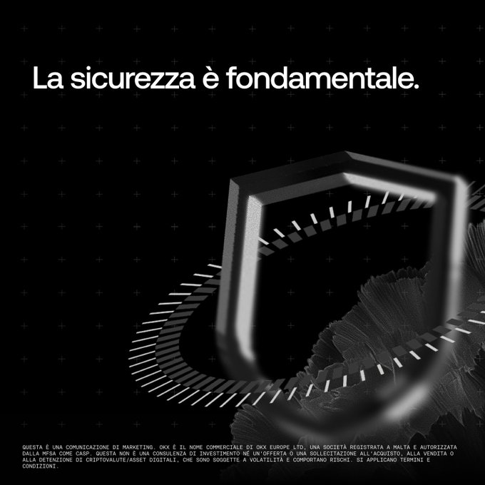A black and white Okx cryptocurrency advertisement featuring a metallic shield icon and the Italian text 'La sicurezza è fondamentale.'