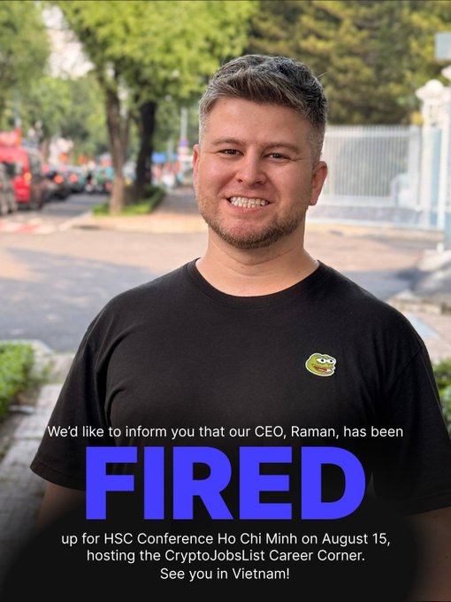 A smiling man wearing a black Pepe the Frog t-shirt stands outdoors with text overlay announcing that CEO Raman has been "FIRED" from his desk to attend the HSC Conference in Ho Chi Minh on August 15, where CryptoJobsList will host the Career Corner at Hilton Saigon.