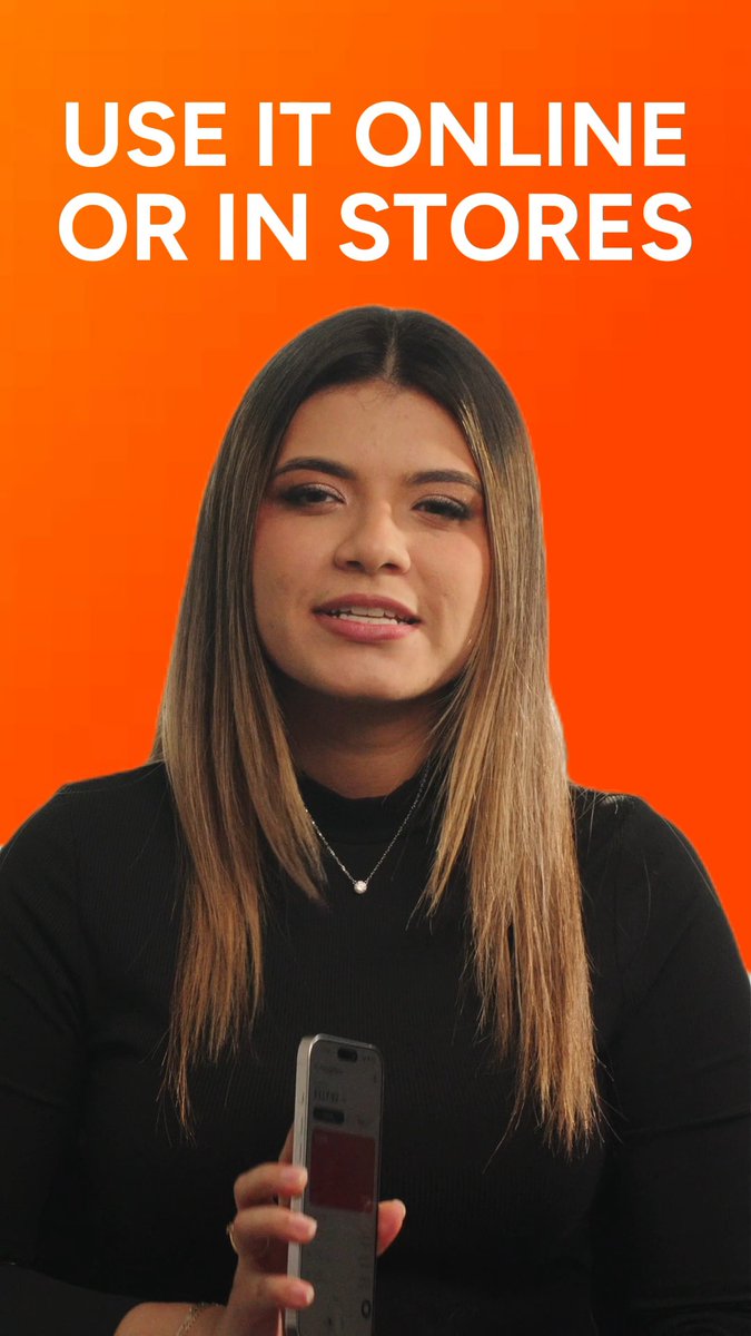 A woman with long straight hair wearing a black turtleneck holds a smartphone against an orange background with white text reading 'USE IT ONLINE OR IN STORES'.