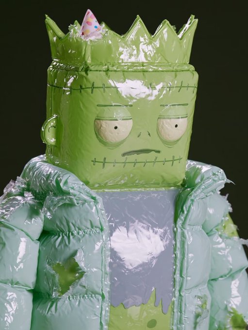 A glossy, inflatable-style Frankenstein monster figure sports a grumpy stitched expression beneath a green crown, complete with a tiny pink party hat perched on top — matching the post's celebration of the festive, puffy NFT icon.
