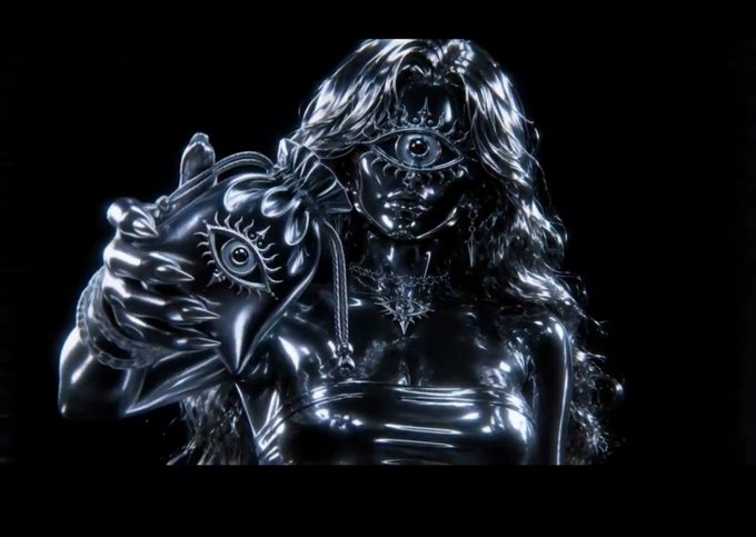 A chrome-like 3D rendering of a female figure with an eye motif for a face is shown, holding a heart-shaped object also featuring an eye design, evoking the mystical and surreal aesthetic often associated with Web3 NFT collections. The image complements the post's excitement about a hyped NFT mint for "0xNTRPY," with the eerie, otherworldly artwork hinting at the artistic vision behind the upcoming release on OpenSea.