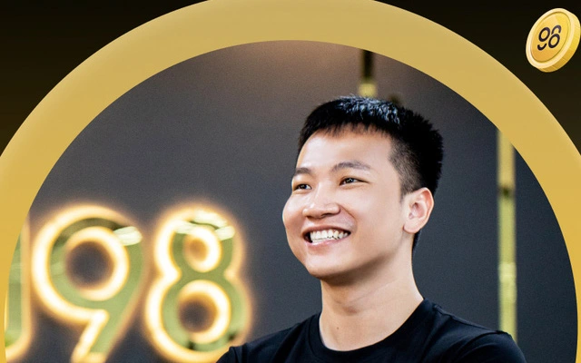A profile photo of a smiling young man framed by a yellow circular border with a '98' neon sign in the background.