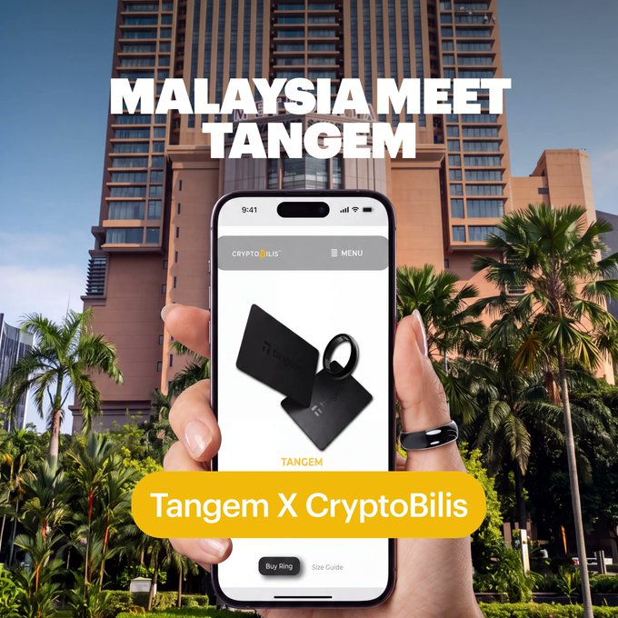 A hand holds a smartphone displaying the CryptoBilis app featuring Tangem card products, set against the Berjaya Times Square skyscraper in Kuala Lumpur, with the promotional text "MALAYSIA MEET TANGEM" and "Tangem X CryptoBilis" highlighting the new retail partnership at the mall's Level 6 store.