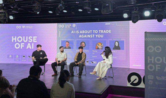 A panel discussion at the 'House of AI' event features four speakers on stage, with the backdrop displaying 'AI IS ABOUT TO TRADE AGAINST YOU' along with moderator and participant profiles.