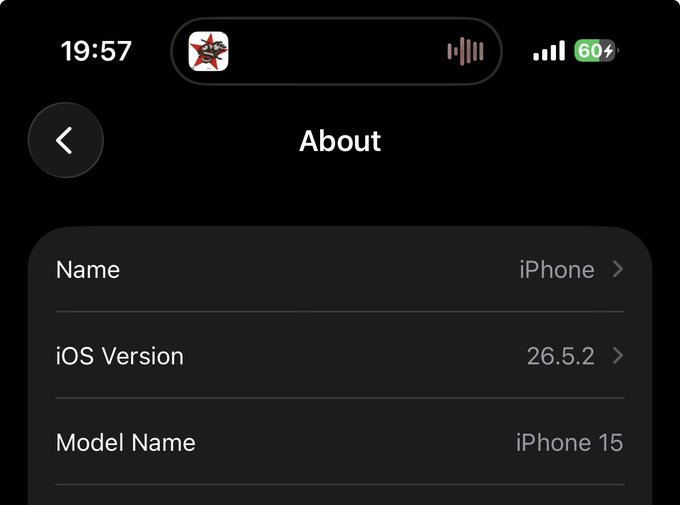 iPhone About screen showing Name: iPhone, iOS Version: 26.5.2, Model Name: iPhone 15, with time 19:57 and 60% battery.