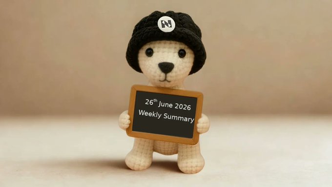 A crocheted teddy bear wearing a black "N" beanie holds a chalkboard sign reading "26th June 2026 Weekly Summary," visually framing Tammy's recap of Numbers Protocol's June milestones.