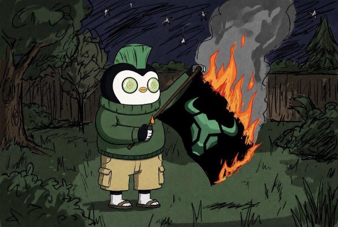 A cartoon penguin character wearing a green sweater and cargo shorts stands outdoors at night, using a match to set fire to a black flag featuring a green "Raviel" logo, symbolizing a "burn" event. This image ties into the post's "gm" giveaway by visually representing the burning of Raviel tokens, reinforcing the cryptocurrency community's optimistic "WAGMI" sentiment.