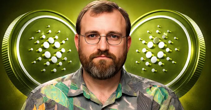 The image shows a man wearing glasses, a beard, and a green shirt with a flower pattern. He appears to be staring at the camera with a serious expression. Below him, there are two coins - one green and one white, set against a green background. The caption of the image reads "Cardano has crashed below $0.20 as founder Charles Hoskinson takes a break from the project. The drop comes right after Hoskinson warned the community about serious failures across the network's ecosystem".