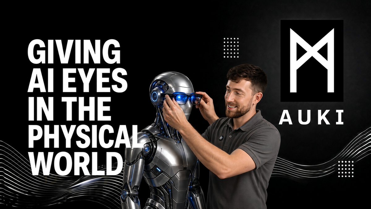 A promotional graphic for "AUKI" featuring a man adjusting glowing blue glasses on a silver humanoid robot, with text reading "GIVING AI EYES IN THE PHYSICAL WORLD."
