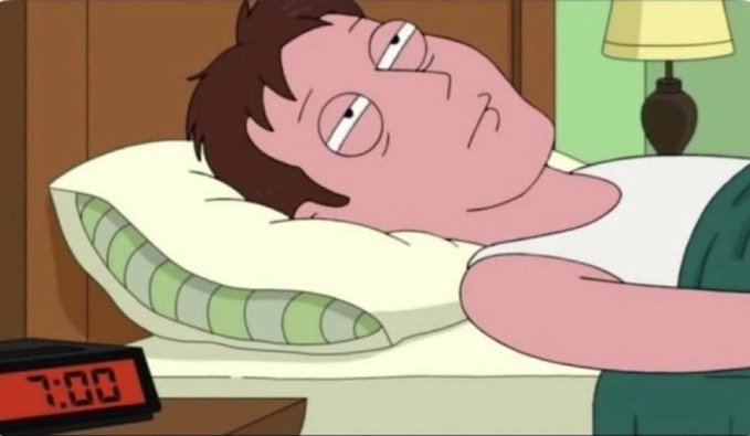 An animated scene shows a character lying in bed looking tired, with a red digital alarm clock displaying '7:00' on the bedside table.