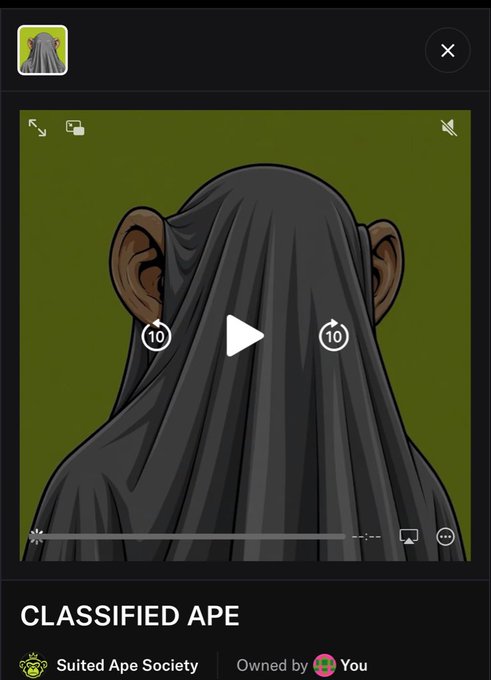 A video player interface displays 'CLASSIFIED APE', a digital collectible from the Suited Ape Society owned by 'You', showing an illustration of a figure draped in a dark grey cloak.