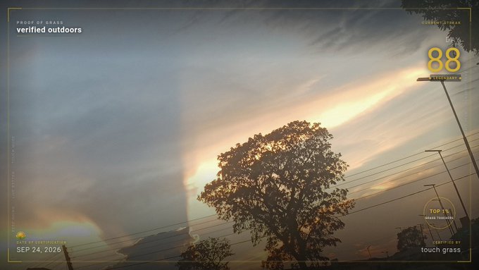 A landscape photograph at sunset showing a silhouetted tree with dramatic clouds, sun rays, and a rainbow on the left, overlaid with graphic text elements including 'PROOF OF GRASS,' 'verified outdoors,' '88 LEGENDARY,' 'SEP 24, 2020,' and 'touch grass.'