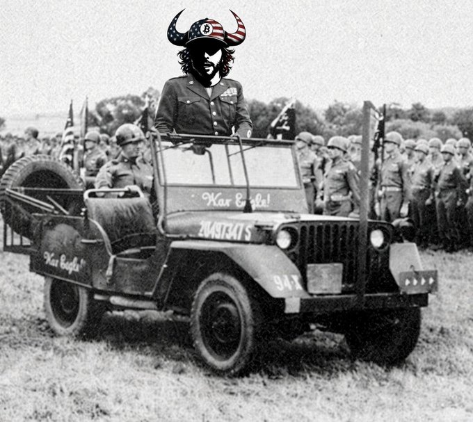 A black-and-white photo of a vintage military jeep labeled 'Karl Bekke!' and '20487347S', with a superimposed figure of a bearded man wearing a horned Viking helmet.
