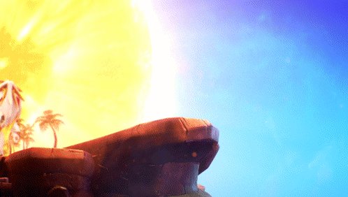 The image depicts a large rock formation with an orange hue at the top, set against a backdrop of a blue sky or ocean. The image shows the sun positioned behind this landmark, casting a warm glow over the scene.