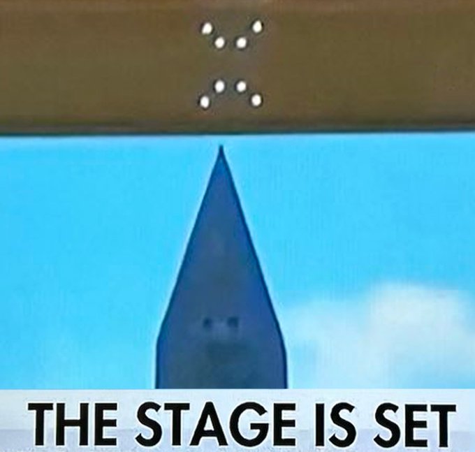 The image shows a wooden stage with a blue object, possibly a hat or a sculpture, placed on top of it. The background features a clear blue sky, which contrasts nicely with the wooden stage. The caption reads "THE STAGE IS SET America250 + XRP". This suggests that the stage is set up for an event and has been prepared to host an activity related to Bitcoin mining.