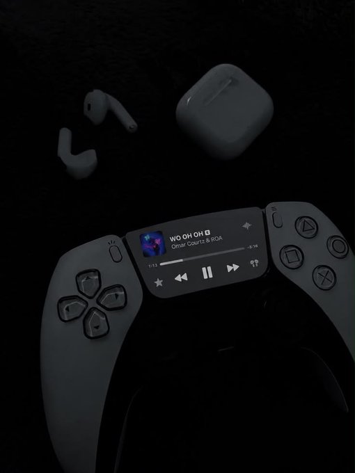 A dimly lit scene shows white wireless earbuds and their case beside a game controller displaying a music player interface with the track "WO OH OH" by Omar Courtz & ROA.