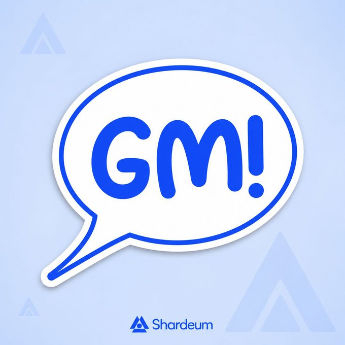 A speech bubble graphic containing the text 'GM!' in blue, with the 'Shardeum' logo at the bottom on a light blue background.
