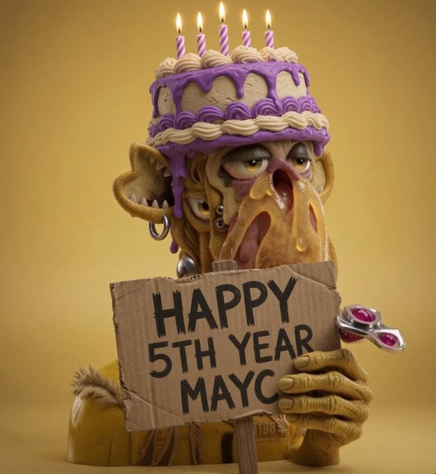 A grotesque 3D-rendered birthday cake-headed creature with a long tongue holds a cardboard sign reading 'HAPPY 5TH YEAR MAYC' against a yellow background.