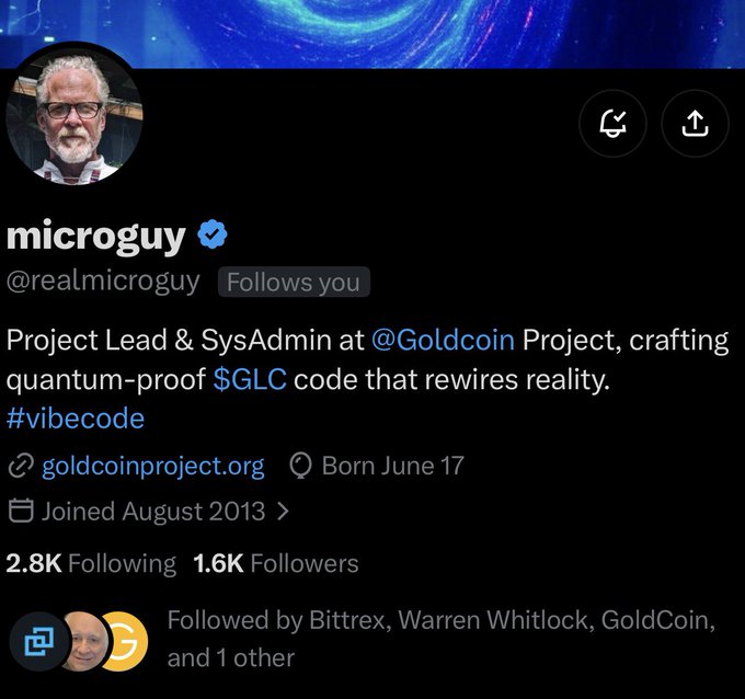 A Twitter/X profile screenshot for 'microguy' (@realmicroguy), verified, describing himself as 'Project Lead & SysAdmin at @Goldcoin Project, crafting quantum-proof $GLC code that rewires reality. #vibecode'.