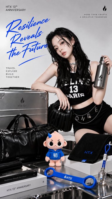 A promotional advertisement for HTX 13th Anniversary featuring a woman holding a metal water bottle, surrounded by HTX-branded merchandise including a silver case, black bags, a mascot plush, and a blue bottle opener, with text reading 'Resilience Reveals the Future,' 'TRAVEL EXPLORE BUILD TOGETHER,' and 'MORE THAN CRYPTO, A BRIGHTER TOMORROW.'