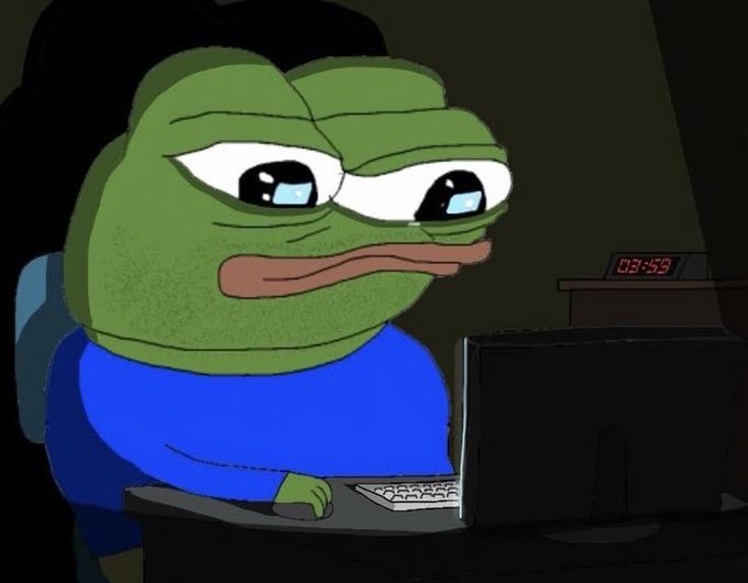 A sad Pepe the Frog meme character sits in a blue shirt in front of a computer monitor with a red digital clock showing "00:00" in the dark.