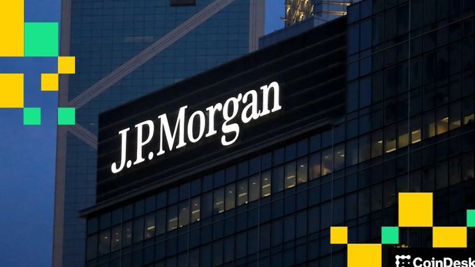 The image shows the J.P. Morgan logo displayed on a modern glass skyscraper, with a CoinDesk watermark in the bottom corner. The caption relates to the post by visually representing the major financial institution that severed ties with crypto prediction platform Polymarket, symbolizing traditional banking's growing caution toward cryptocurrency-related ventures.
