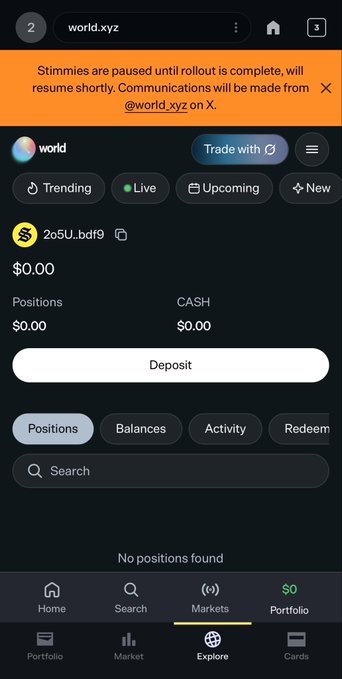 A mobile screenshot of world.xyz shows a "Trade with" button, $0.00 positions and cash, and a banner noting that Stimmies are paused until rollout is complete—matching the post announcing the platform is back live but awaiting a signal from World.