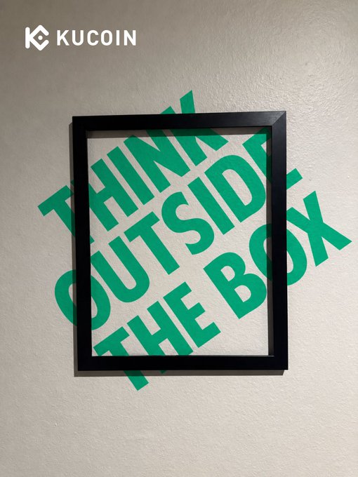 A black picture frame hangs on a beige wall with the green text "THINK OUTSIDE THE BOX" extending beyond its borders, visually illustrating the idiom and reinforcing KuCoin's message of unconventional crypto trading.