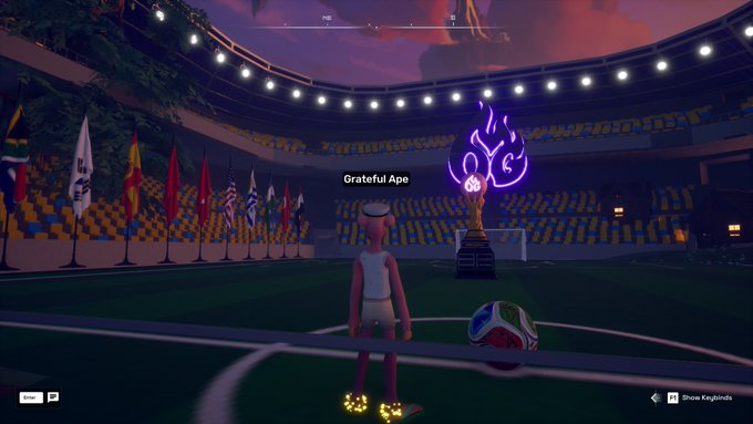 A player named "Grateful Ape" stands in a brightly lit soccer arena within OthersideMeta, facing a glowing purple flaming torch trophy and a soccer ball at center field, with international flags lining the stadium. The scene matches the post's excitement about discovering a mysterious, beautifully crafted secret soccer arena built by an unknown civilization.