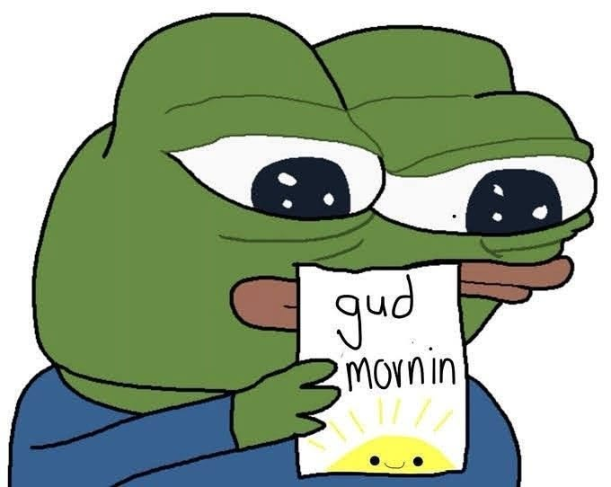 A sad Pepe the Frog holds a handwritten note reading "gud mornin" with a small smiling sun drawing. The melancholic meme contrasts with the post's optimistic "gm" (good morning) crypto greeting about new job opportunities, humorously capturing the bittersweet feeling of starting a new work day in the crypto job hunt.