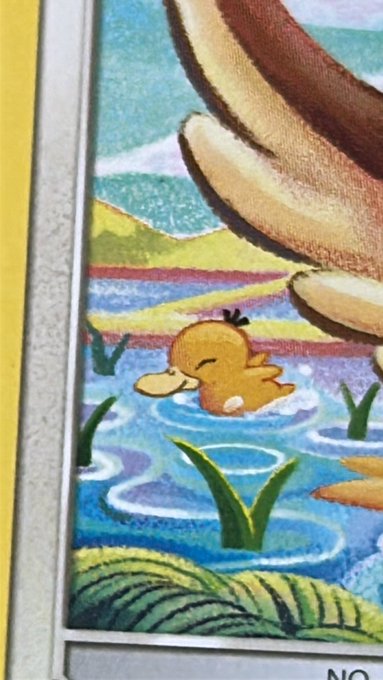 A cheerful Psyduck floats happily in a pond on this Pokémon trading card, with the partial text "NO" visible at the bottom edge, capturing the duck's blissful expression that matches the caption's sentiment of pure joy.