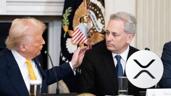 Donald Trump sits beside his crypto advisor David Sacks in the White House, with the presidential seal and an XRP logo overlaid, visually linking the post's promotion of "REAL Token" to Trump's administration and the XRP Ledger ecosystem.