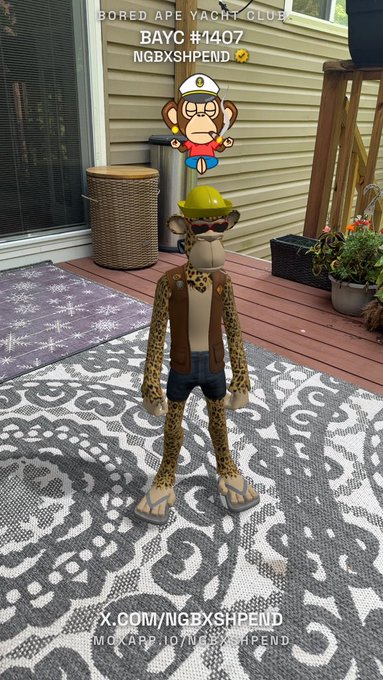 An NFT-style ape character labeled 'BAYC #1407 NGBXSHPEND' wearing a hard hat and construction vest, displayed on a residential deck.