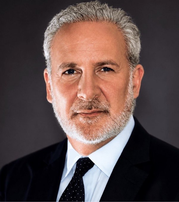 A professional headshot of Peter Schiff, a middle-aged man with gray hair and a trimmed beard, wearing a dark suit, light blue shirt, and dark patterned tie, gazing directly at the camera. The image corresponds to the post, visually identifying the financial commentator who is criticizing the Bitcoin rally as a "fakeout" and urging investors to sell $BTC in favor of gold.