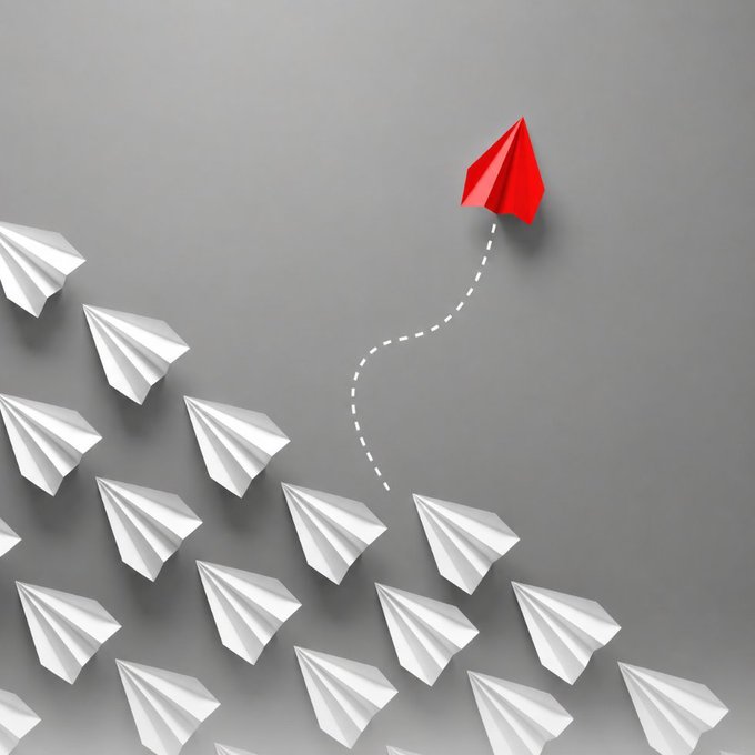 A conceptual image shows multiple white paper airplanes flying in formation, with one red paper airplane breaking away along a dotted path.