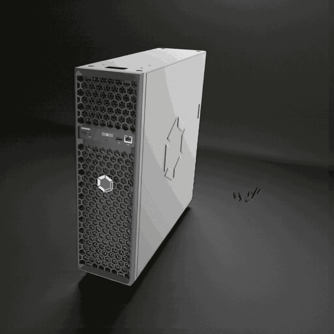 A white compact cryptocurrency mining ASIC miner (resembling a Bitaxe or similar home miner) with a hexagonal mesh front panel, control buttons, and USB port sits on a dark surface. The image visually represents the home Bitcoin mining hardware being compared in the post, where the Nano 3S, Mini 3, and Avalon Q are evaluated for heat, noise, power, and cost before placing one in a residential room.