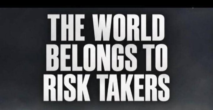 A black and white motivational quote reads 'THE WORLD BELONGS TO RISK TAKERS'.