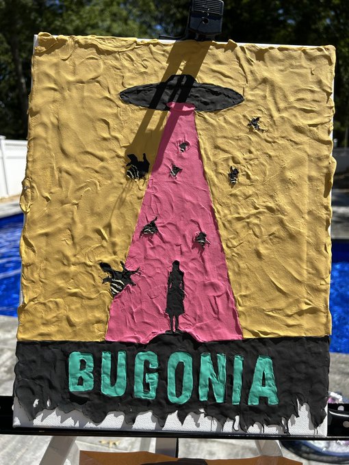 A textured painting displayed on an easel depicts a silhouetted figure standing beneath a UFO beam of pink light surrounded by bees, with the title "BUGONIA" in bold teal letters across the bottom. The artwork's alien abduction theme and handmade craft aesthetic reflect the artist's passion for creative expression, which they credit NFTs with enabling during a five-year journey in web3.