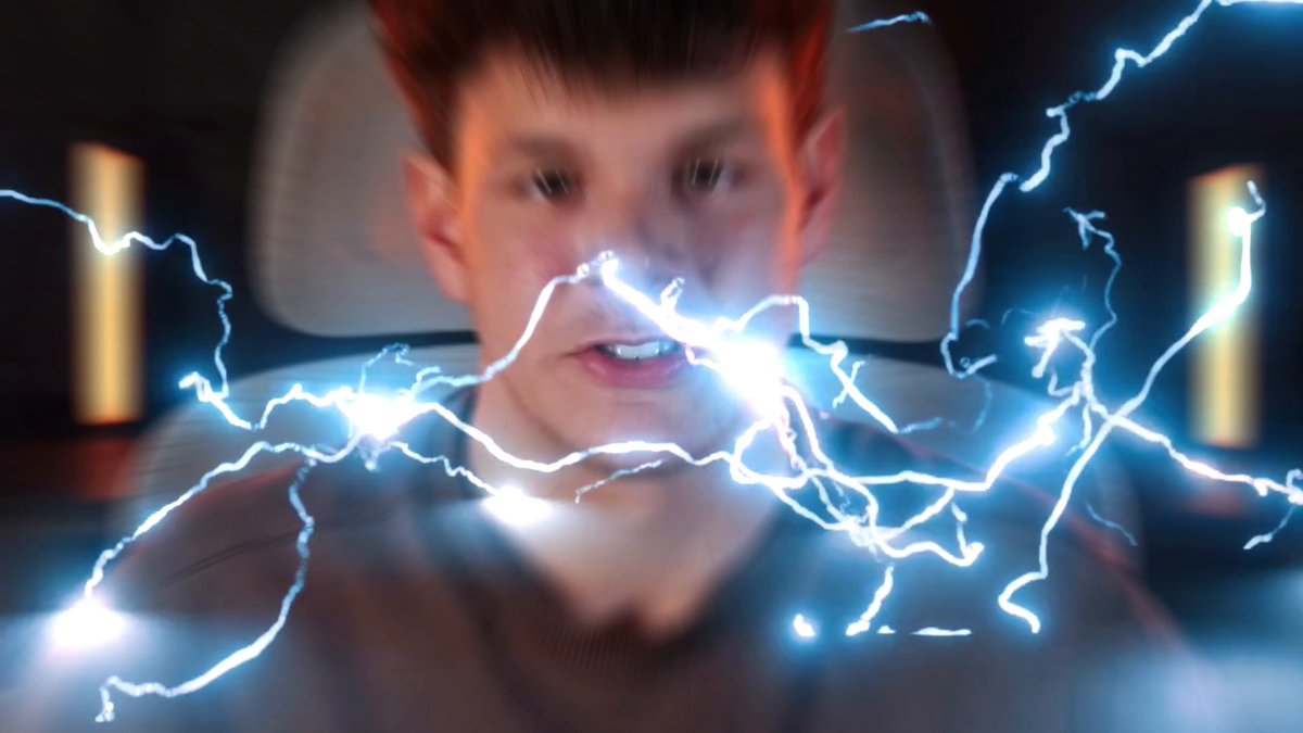 The image features a man with red hair, wearing a brown shirt, sitting inside a car while being bombarded by lightning bolts. The lightning appears to be coming from behind him, creating an intense and dramatic effect as he looks directly into the camera. The caption below the photo reads "Why Normies Will Inevitably Buy $TROLL". This phrase is likely a reference to the popular internet meme about men's susceptibility to online shopping temptations due to their vulnerability during moments of stress or excitement, such as when they are bombarded by unexpected and intense stimuli like lightning.

The image also includes some text that reads "Why Normies Will Inevitably Buy $TROLL". This phrase is likely a reference to the internet meme about men's susceptibility to online shopping temptations due to their vulnerability during moments of stress or excitement, such as when they are bombarded by unexpected and intense stimuli like lightning bolts.