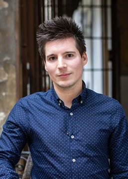 A young man with dark, spiky hair wearing a navy blue polka-dot button-up shirt poses for a portrait. The image likely depicts Rui Pinto, the Manchester City whistleblower mentioned in the post, who is set to make a significant announcement.