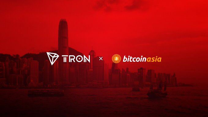 A promotional image featuring 'TRON x bitcoin asia' logos against a red-tinted Hong Kong skyline showing the IFC building and harbor.