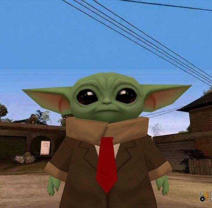A digital character resembling Grogu (Baby Yoda) wearing a brown robe and red tie, set against a background that appears to be from a video game.