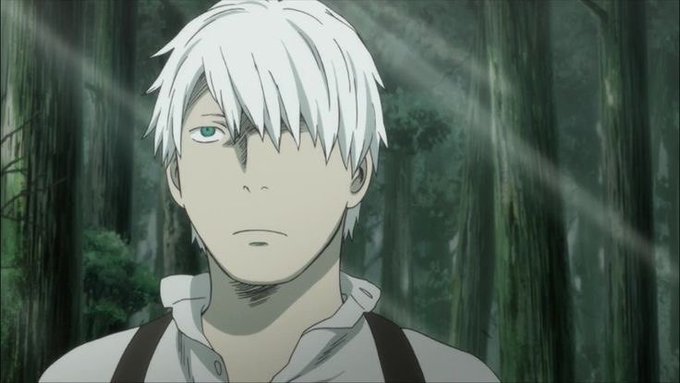 An anime screenshot showing a white-haired male character with one blue eye, wearing a white shirt and suspenders, standing in a forest with light rays filtering through the trees.