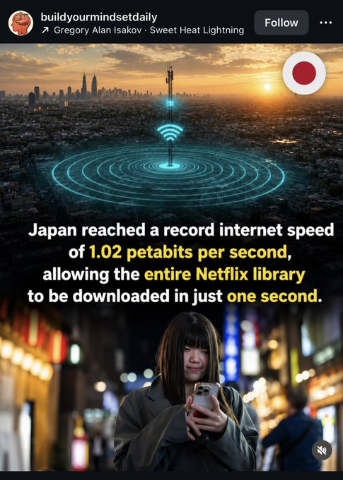 The image features a woman holding her cell phone, possibly taking a picture or reading an interesting message. There are two other people visible in the background of the photo, one standing behind the woman and another person partially hidden by the woman's shoulder. The main focus is on the woman with the cell phone, but there are also some texts present that read "Japan reached a record internet speed of 1.0 petabits per second" and "allowing the entire Netflix library to be downloaded in just one second".
