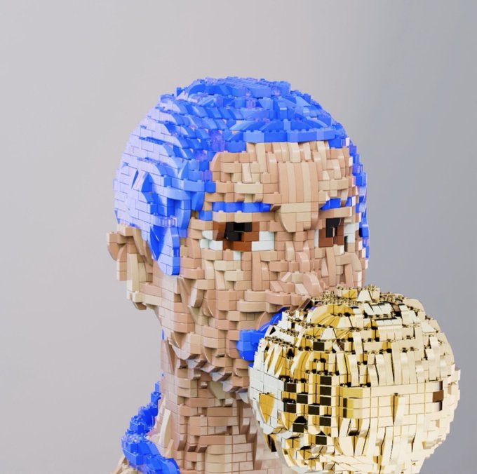 A 3D sculpture of a person with blue hair rendered in a pixelated/voxel style, holding a golden, blocky object.