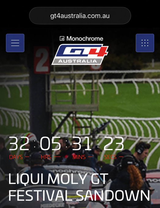 A countdown timer on gt4australia.com.au shows 32 days, 5 hours, 31 minutes, and 23 seconds remaining until the Liqui Moly GT Festival at Sandown, featuring the GT4 Australia logo with Monochrome as the official naming rights partner over a blurred background of pit crew and race officials. The image ties directly to Monochrome's promotion of its $MCR token offering, highlighting exclusive race-weekend experiences available to select token holders.