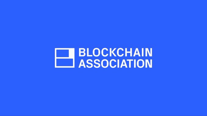 The Blockchain Association's logo is displayed in white against a solid blue background, representing the organization advocating for limited stablecoin verification requirements only when users transact directly with issuers, rather than expanding regulations to cover all transactions.
